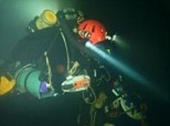 British explorer leads team to the lowest depths recorded by cavers, venturing almost a mile underground through pitch black tunnels, including 600m underwater swim